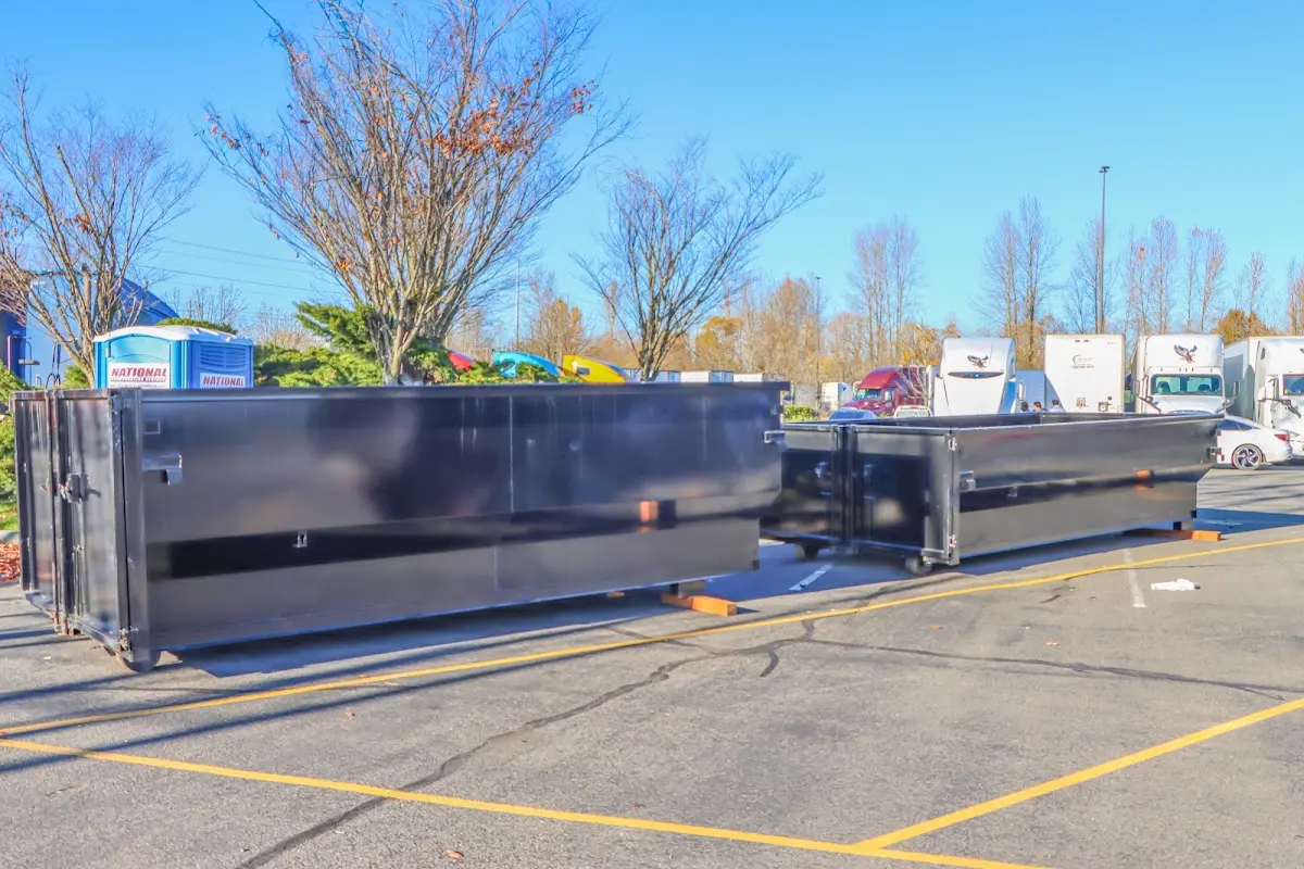 Professional dumpster rental service with roll-off container on residential driveway in Bradfordville